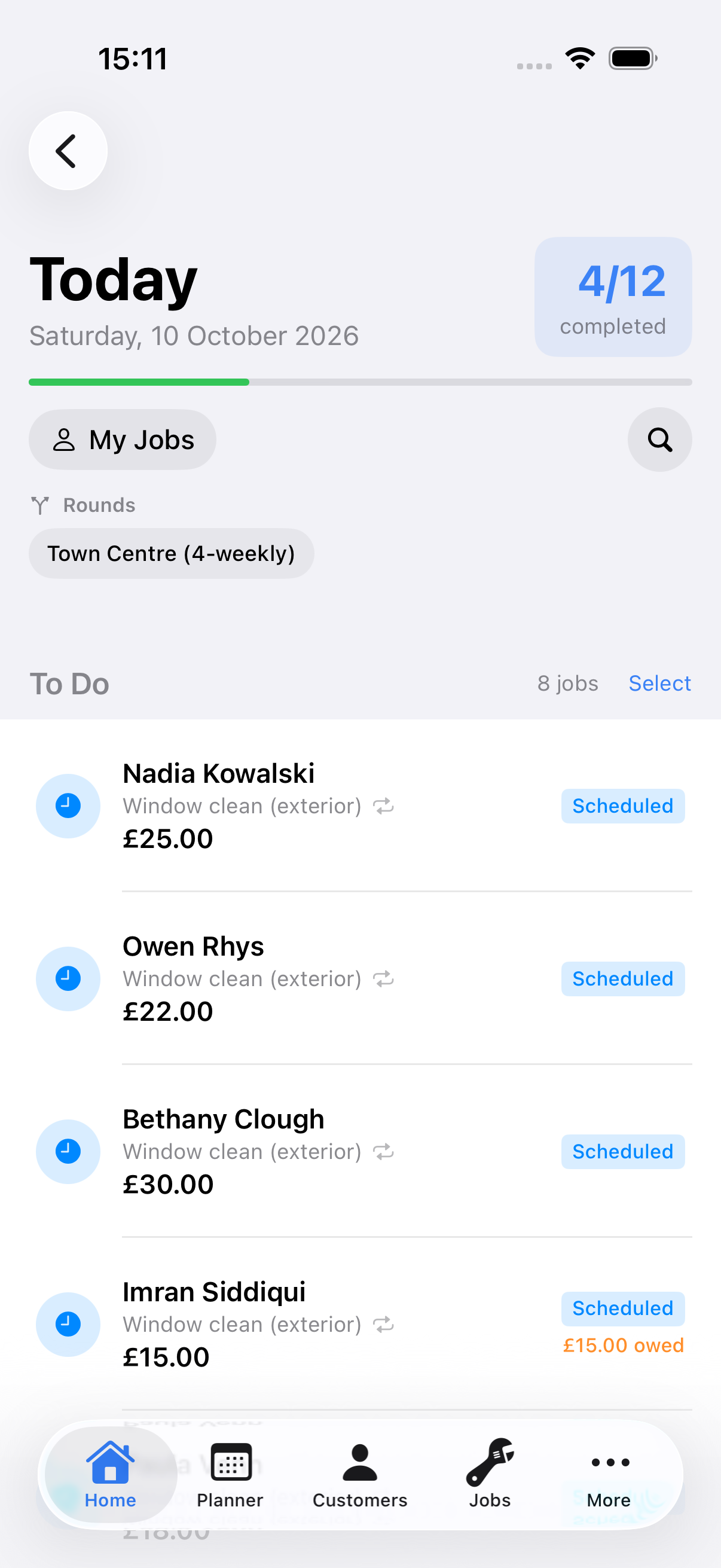 Example data: iPhone job details for a fictional window-cleaning visit, scrolled to the actions, showing the Mark as Completed and Complete & Take Payment buttons